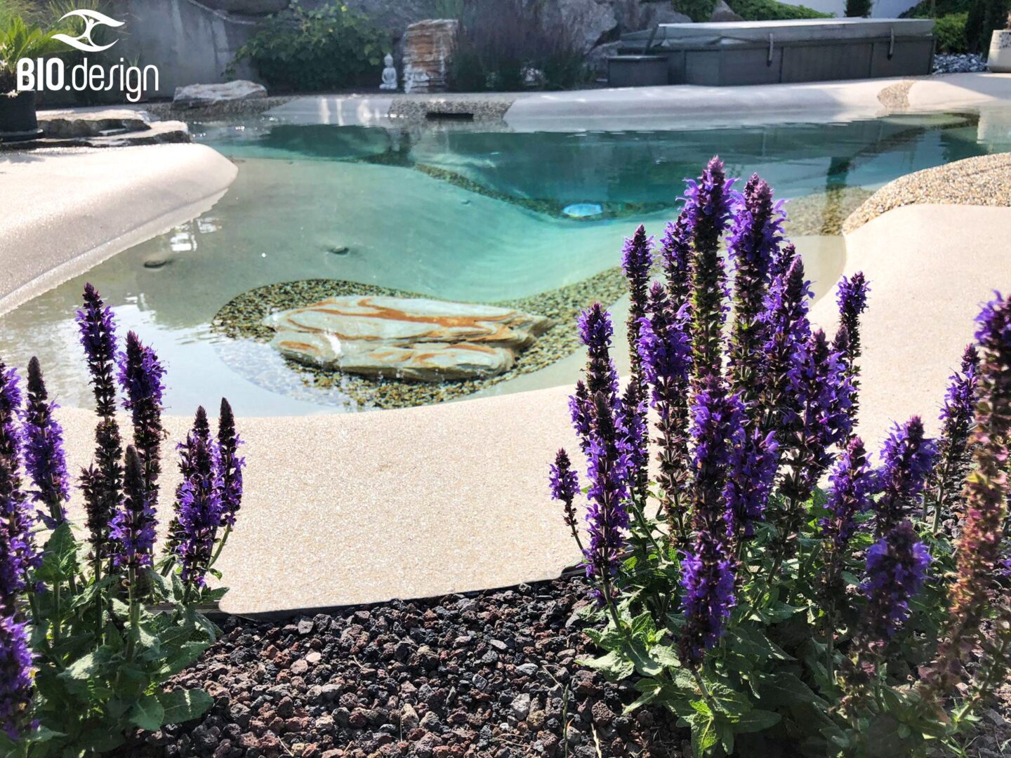 A Bio Design Natural Pool With Violet Flowers