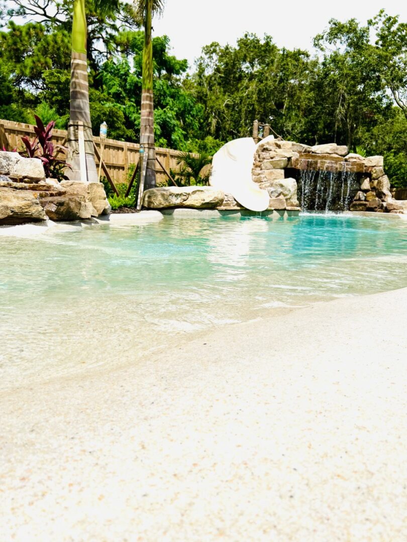 Closeup shot of the beach water and trees around